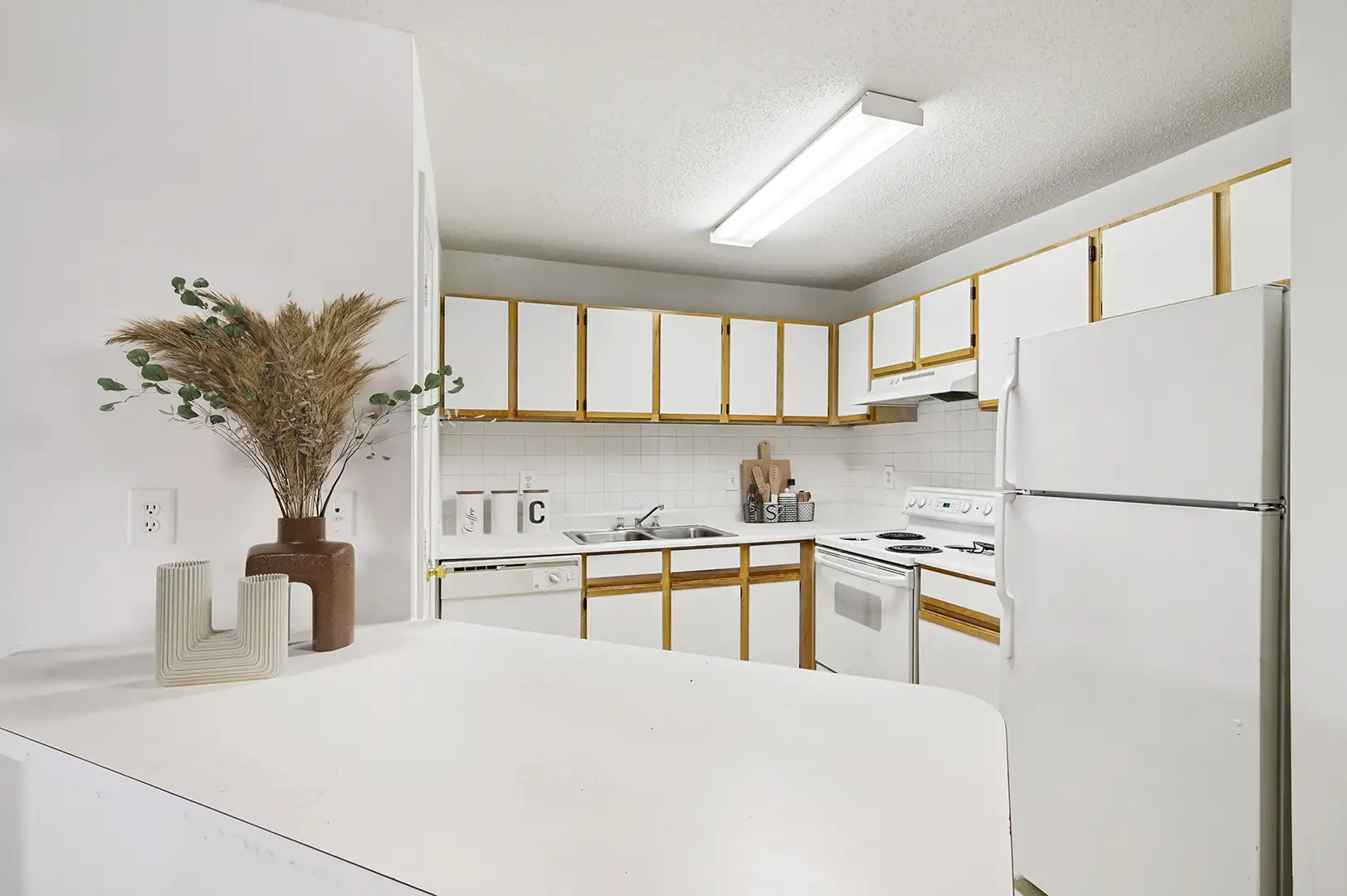 Kitchen with white cabinet doors and white appliances