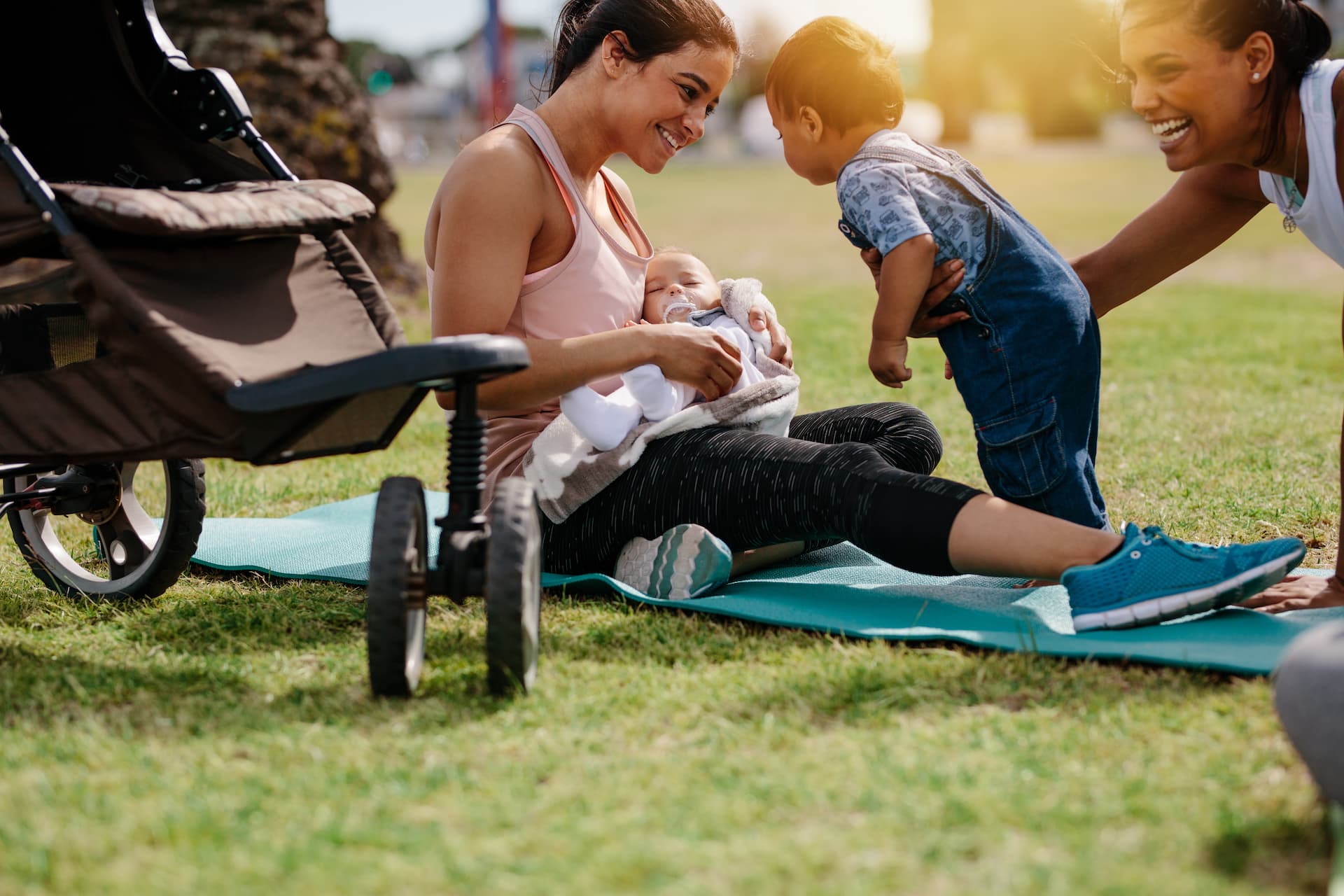 Women playing with children in the park