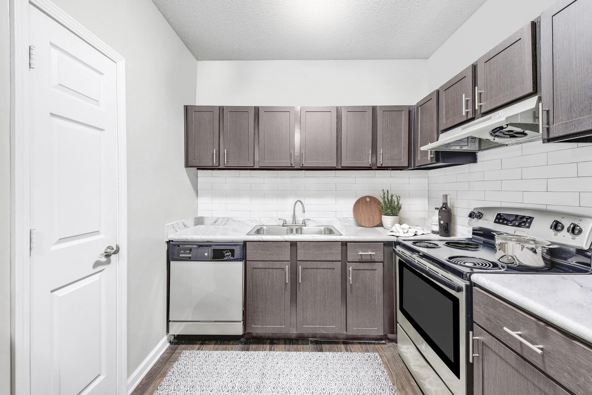 Kitchen with brown cabinets and stainless steel appliances